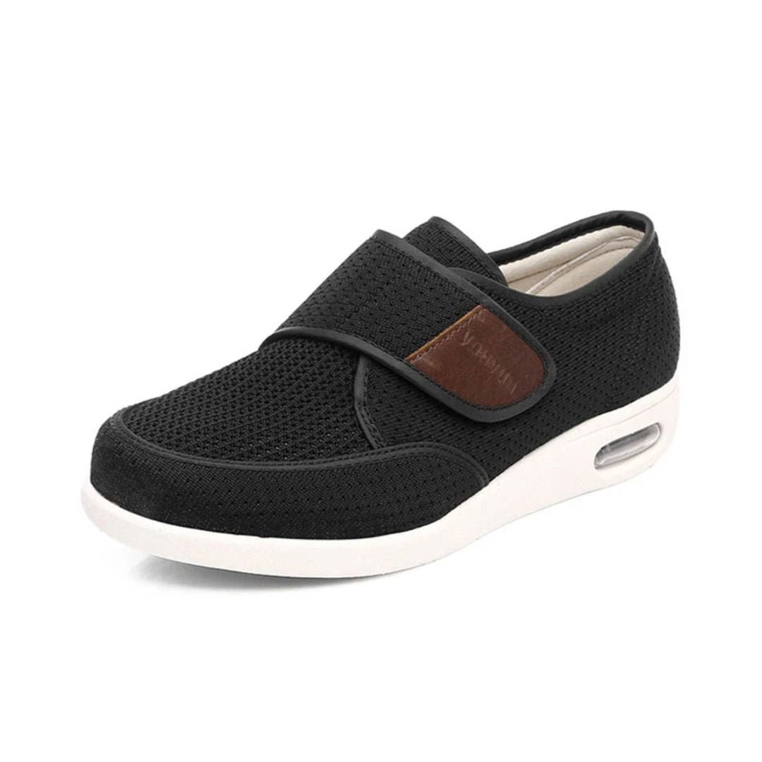 Black wide orthopedic shoes with hook-and-loop straps across the instep