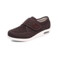 Black wide orthopedic shoes with hook-and-loop straps across the instep