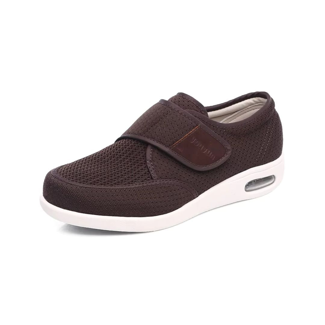 Black wide orthopedic shoes with hook-and-loop straps across the instep