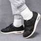 Orthopedic shoes with a wide hook-and-loop strap across the instep for easy slip-on