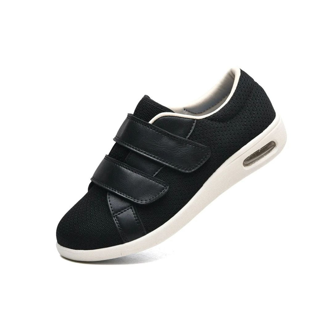 Orthopedic shoes with a wide hook-and-loop strap across the instep for easy slip-on