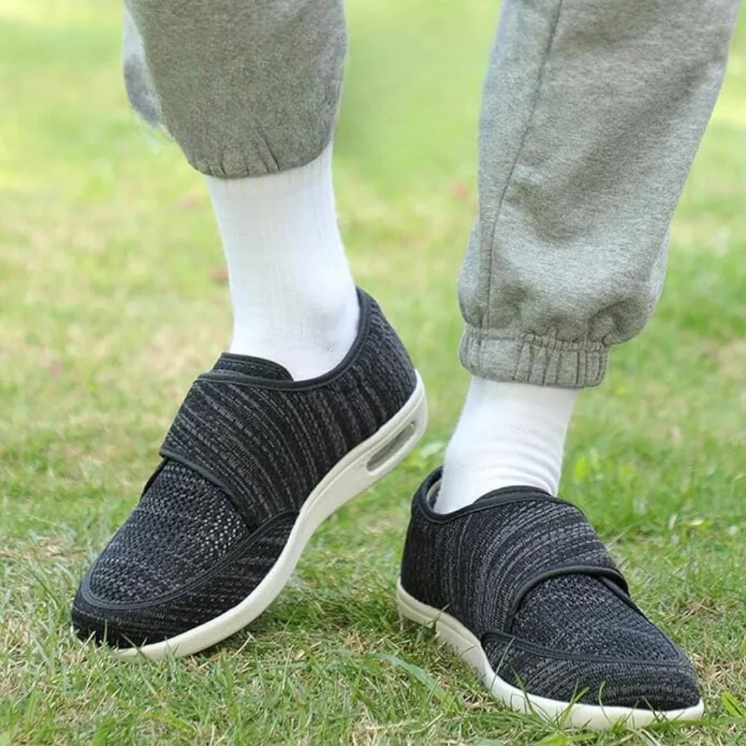 Black wide orthopedic shoes with hook-and-loop straps across the instep