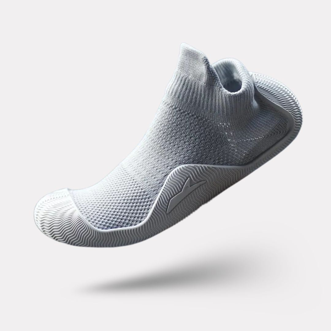 Soft barefoot style orthopedic shoes with a thin flexible sole, in gray, black, white or purple