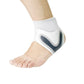White ankle brace with crossed straps wrapped around a weak ankle