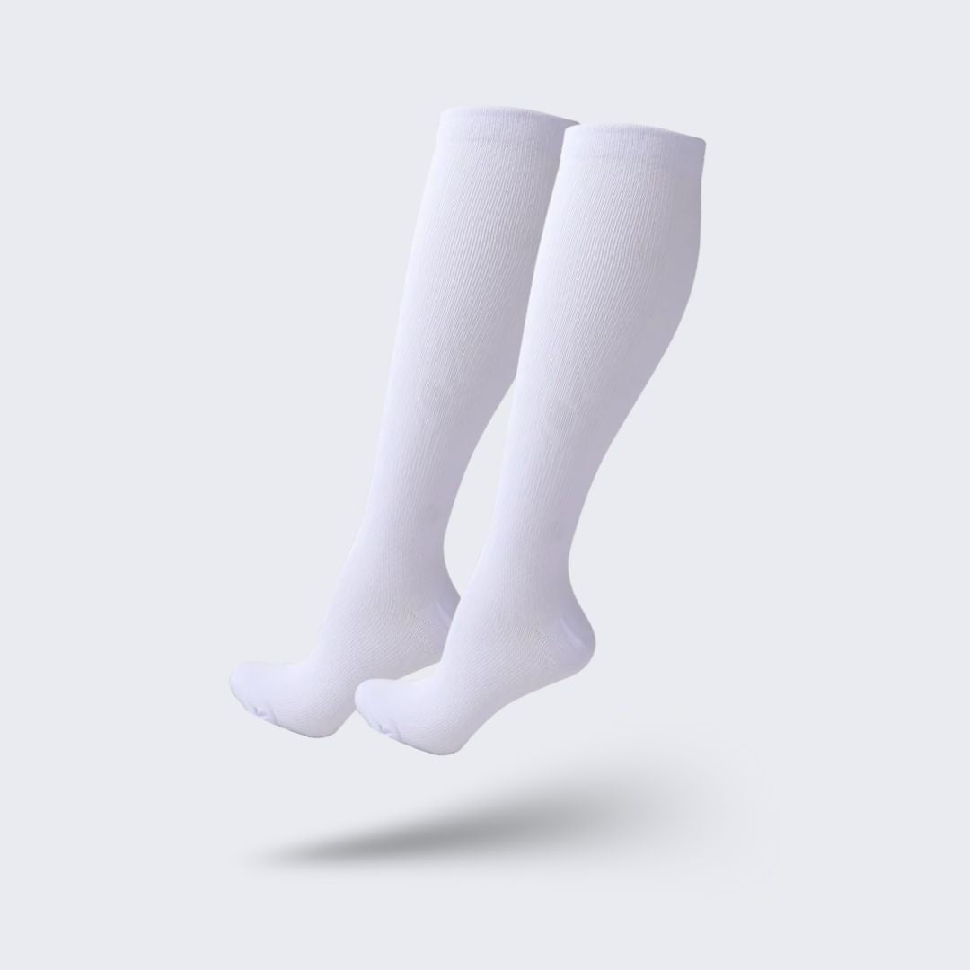 Medical compression socks rated 20 to 30 mmHg in black, white and beige, worn up to the knee