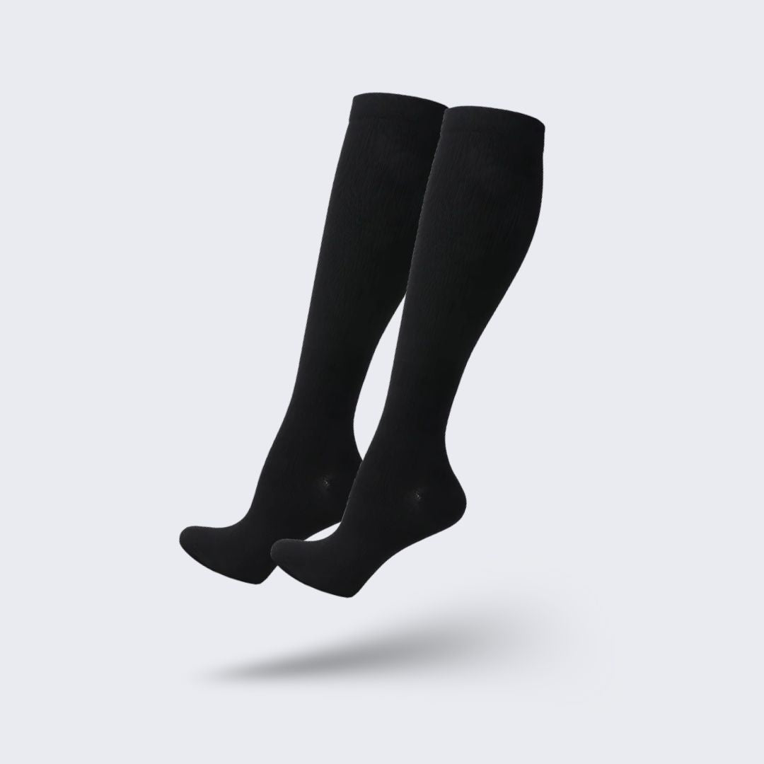 Medical compression socks rated 20 to 30 mmHg in black, white and beige, worn up to the knee