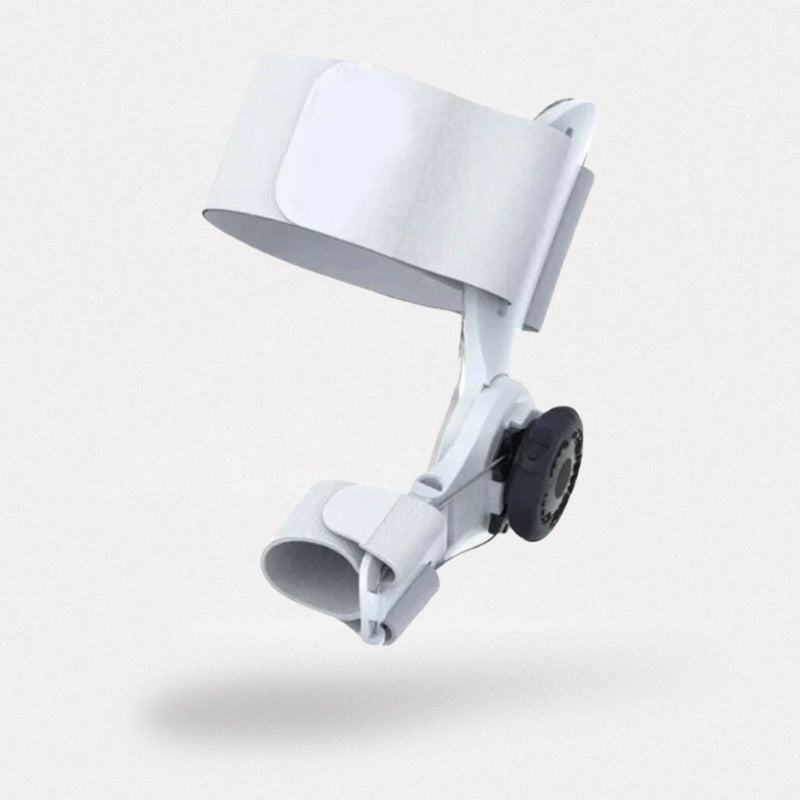 Universal bunion corrector held over the big toe by a strap around the forefoot