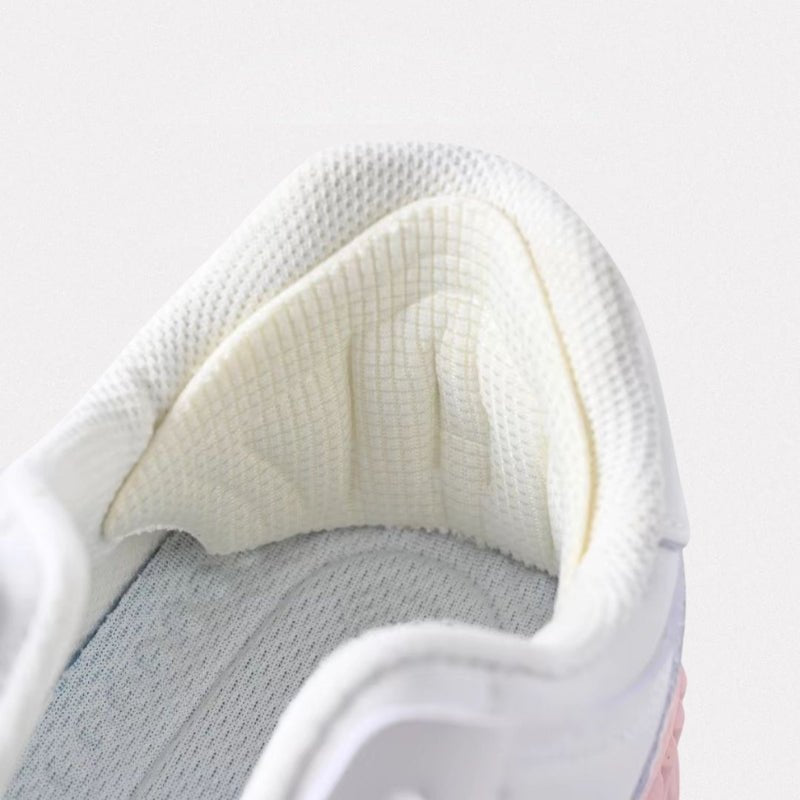 Clear adhesive anti-friction pads trimmed to fit the back of the heel