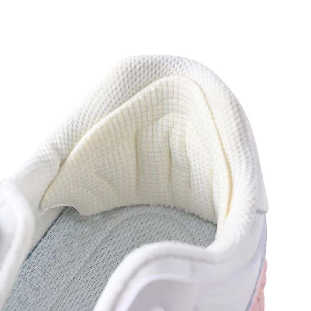 Clear adhesive anti-friction pads trimmed to fit the back of the heel