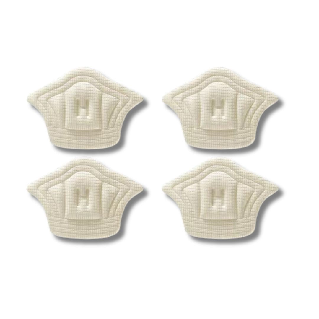 Clear adhesive anti-friction pads trimmed to fit the back of the heel