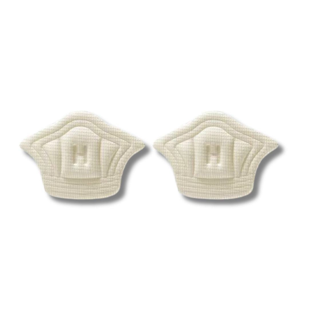 Clear adhesive anti-friction pads trimmed to fit the back of the heel