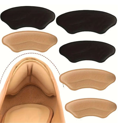 Clear adhesive heel pads stuck inside the shoe to stop rubbing at the heel