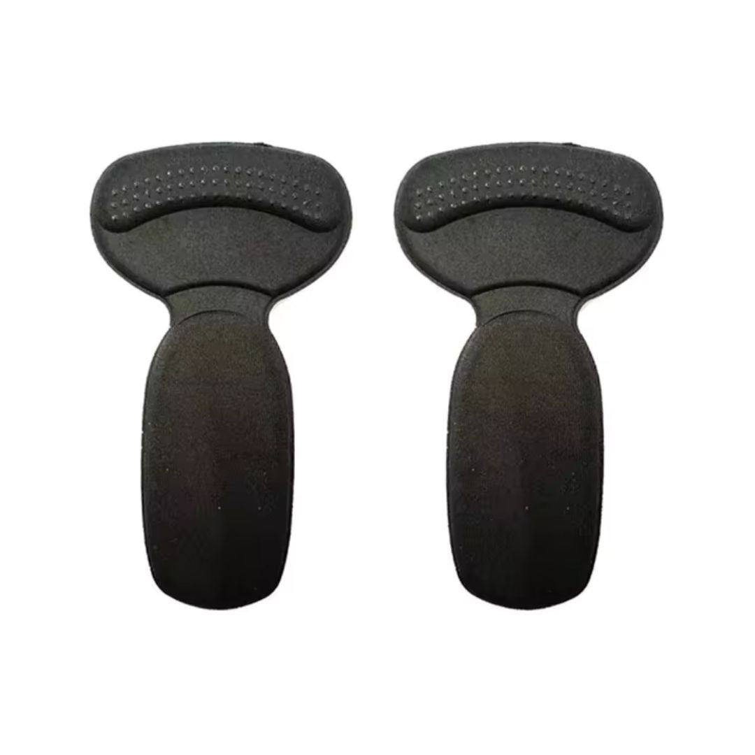 Clear anti-friction pads in black and beige, stuck inside the back of a high heel