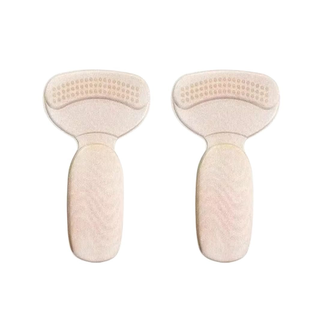 Clear anti-friction pads in black and beige, stuck inside the back of a high heel