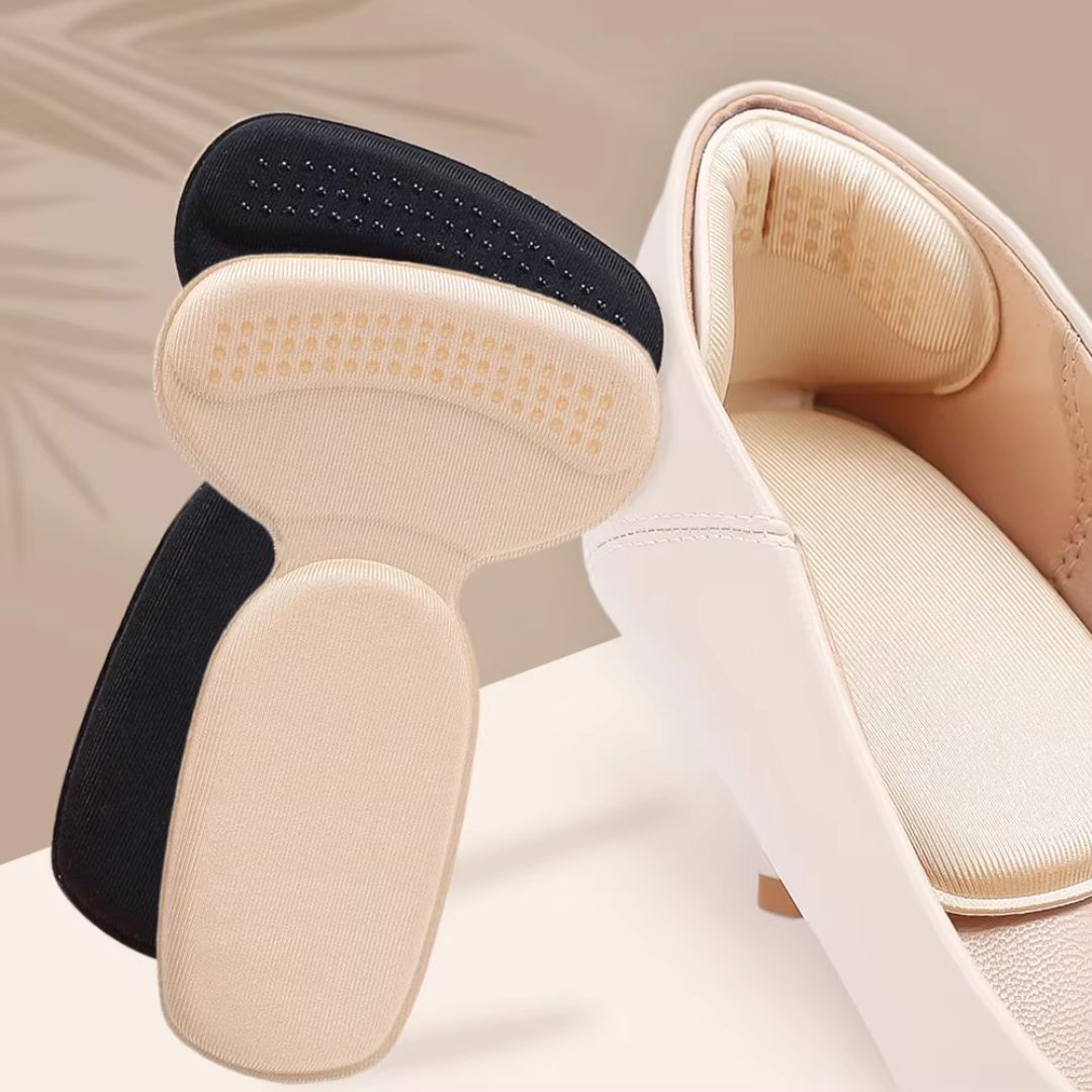 Clear anti-friction pads in black and beige, stuck inside the back of a high heel