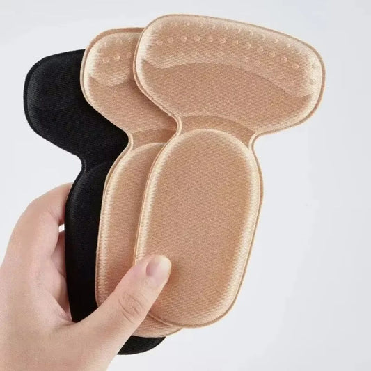 Clear anti-friction pads in black and beige, stuck inside the back of a high heel