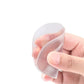 Pair of clear gel metatarsal pads cushioning the ball of the foot inside the shoe