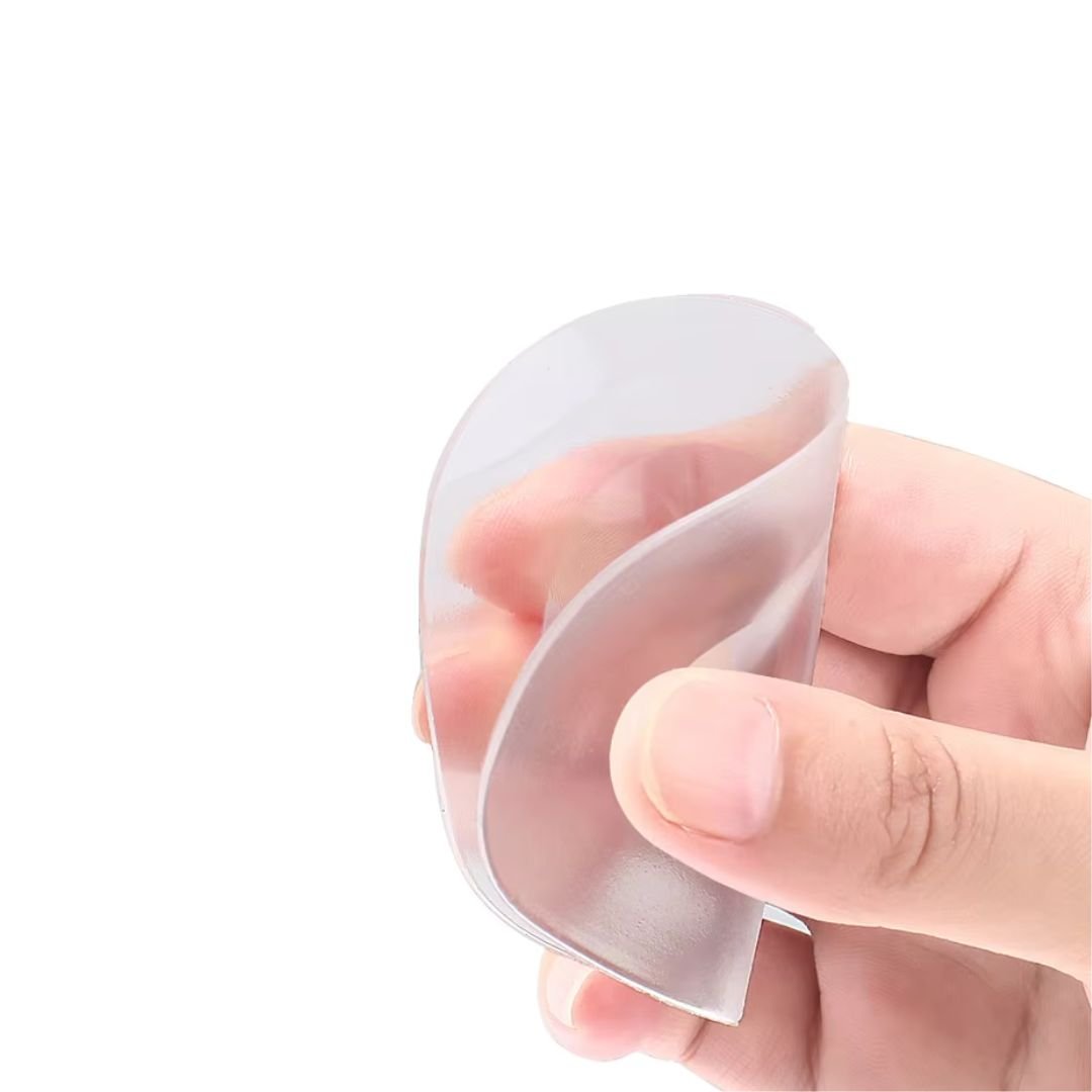 Pair of clear gel metatarsal pads cushioning the ball of the foot inside the shoe