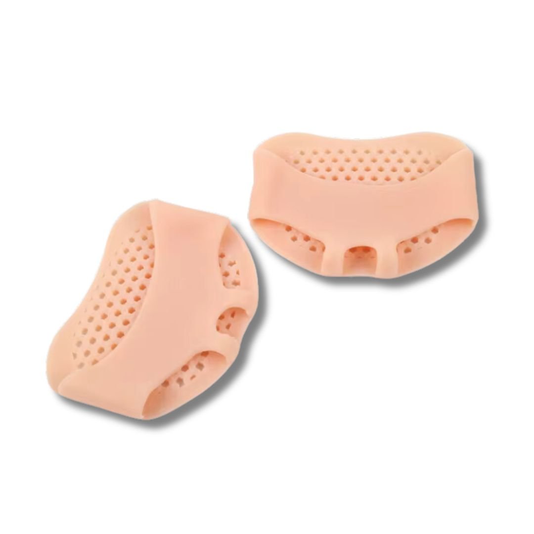 Silicone metatarsal pads in white, clear black and nude, worn under the ball of the foot