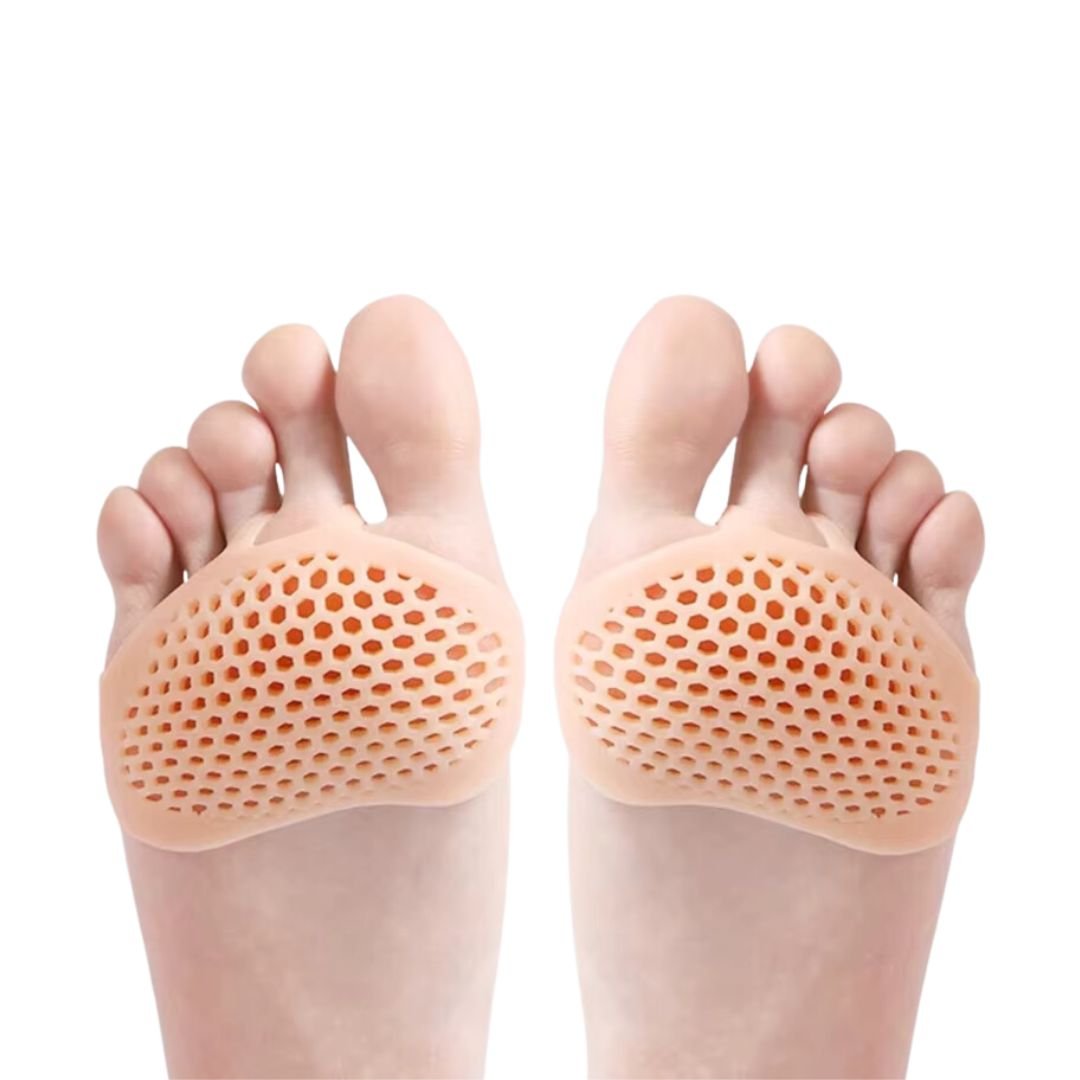 Silicone metatarsal pads in white, clear black and nude, worn under the ball of the foot