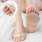 Gel metatarsal pads in nude or clear black, placed under the ball of the foot in heels