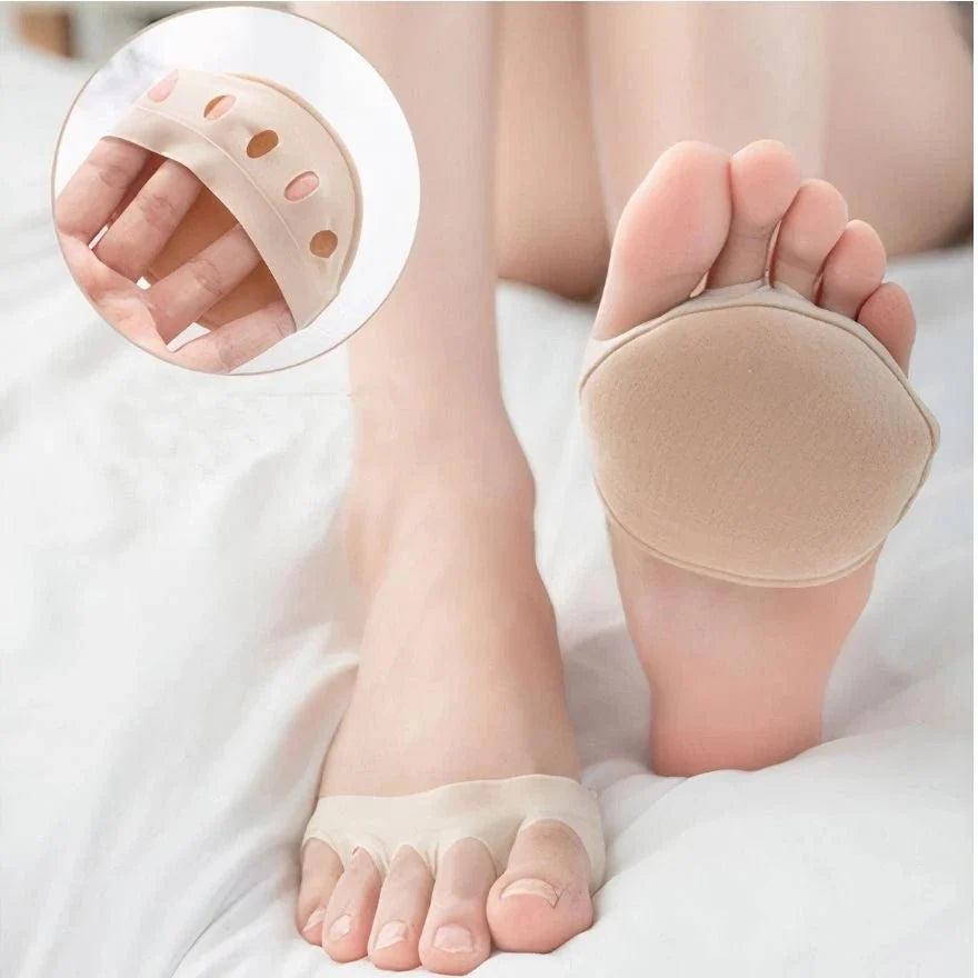 Gel metatarsal pads in nude or clear black, placed under the ball of the foot in heels