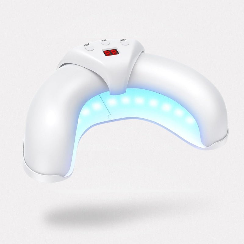Handheld light therapy device held over the toenail to treat nail fungus