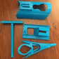 Stocking donner kit with a curved frame that holds a compression stocking open