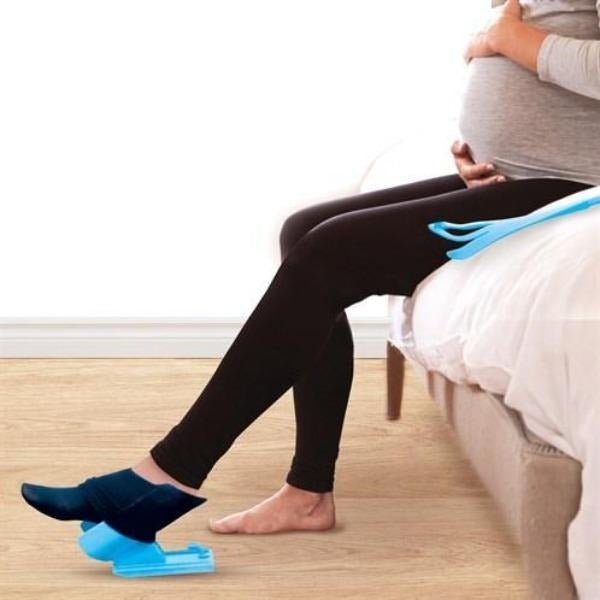 Stocking donner kit with a curved frame that holds a compression stocking open