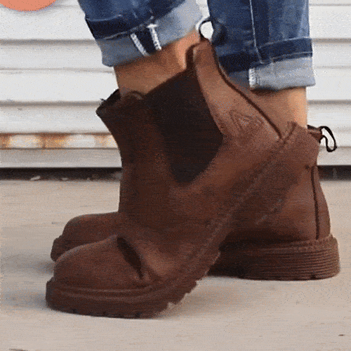 Brown leather safety boots with a reinforced toe and a lace-up ankle shaft