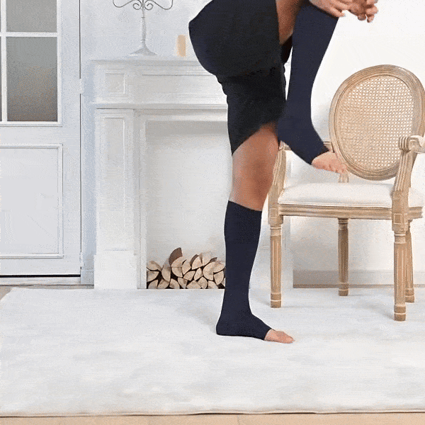 Breathable open-toe compression socks in black and beige, worn up the calf