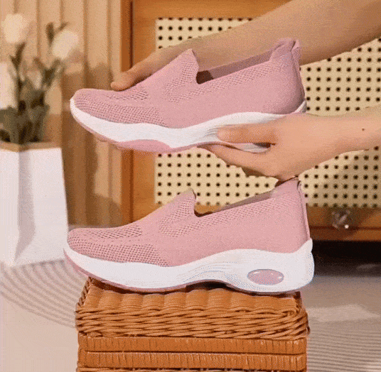 Pink orthopedic sneakers with a soft knit upper and cushioned arch support