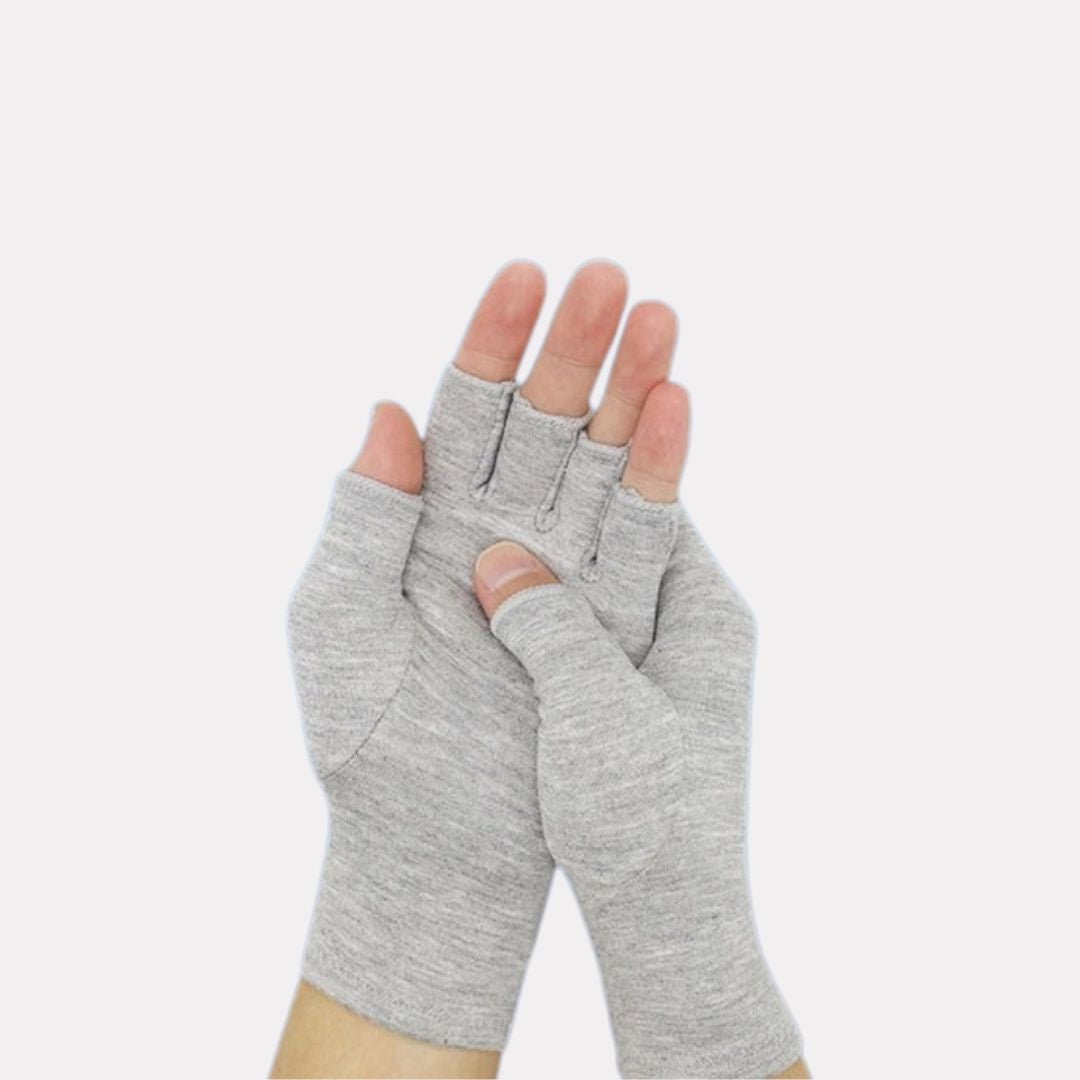 Fingerless compression gloves worn over the hands for arthritis relief