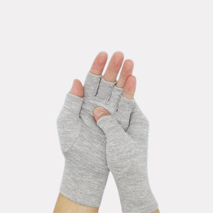 Fingerless compression gloves worn over the hands for arthritis relief