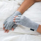 Fingerless compression gloves worn over the hands for arthritis relief