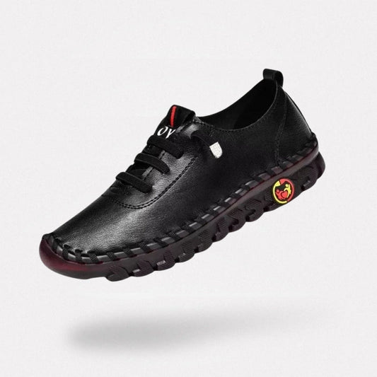 Orthopedic loafers with a slip-on upper and cushioned sole, in black, brown, white and red