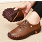 Orthopedic loafers with a slip-on upper and cushioned sole, in black, brown, white and red