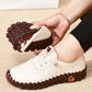 Orthopedic loafers with a slip-on upper and cushioned sole, in black, brown, white and red