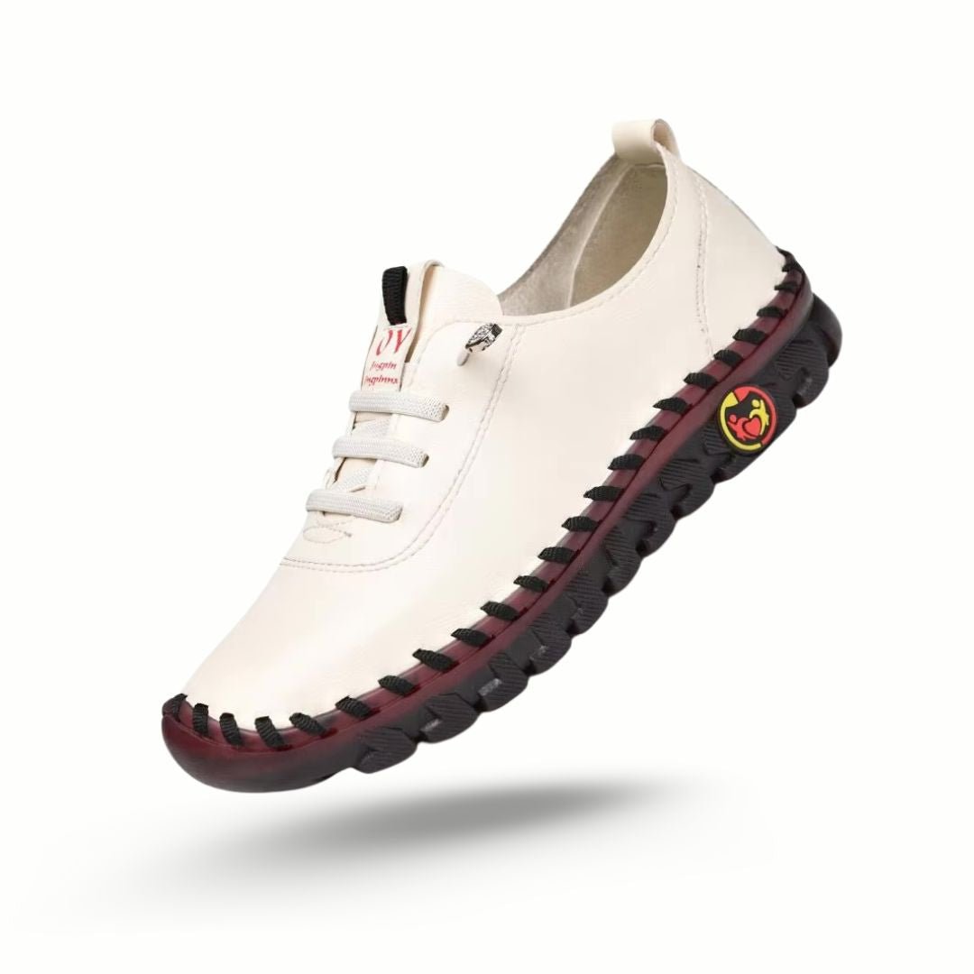 Orthopedic loafers with a slip-on upper and cushioned sole, in black, brown, white and red