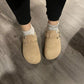 Suede leather mules open at the heel on a cork and leather sole, in taupe, black and navy