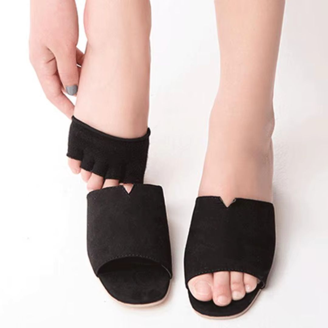 Soft silicone separator worn between all five toes, in nude or clear black