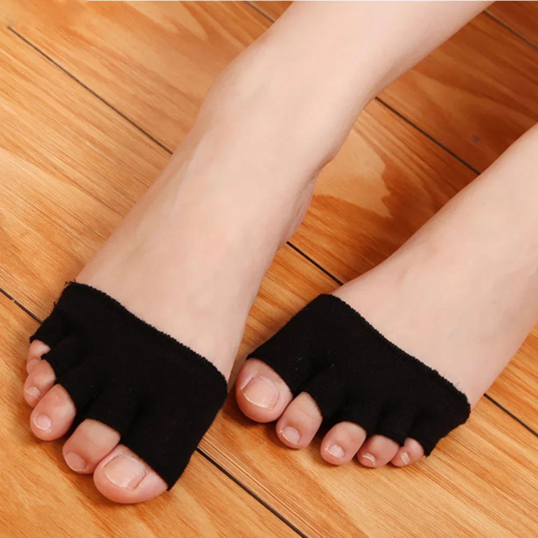 Soft silicone separator worn between all five toes, in nude or clear black
