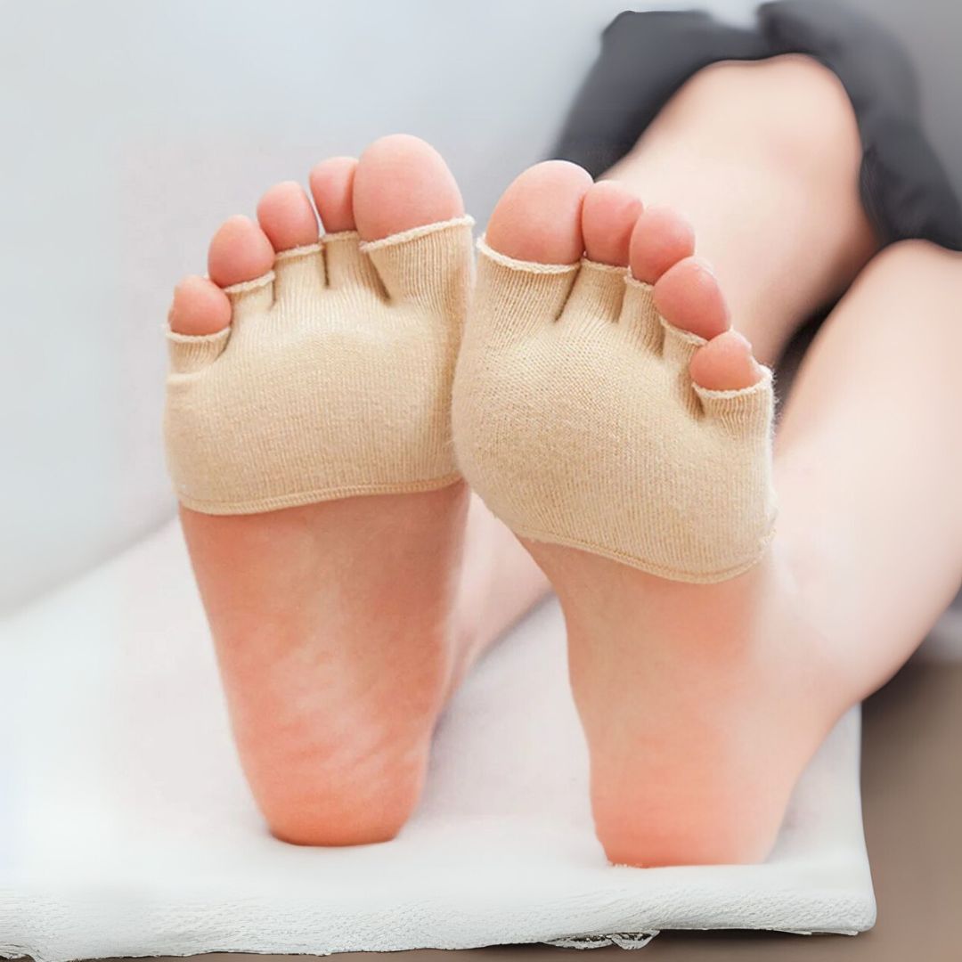 Soft silicone separator worn between all five toes, in nude or clear black