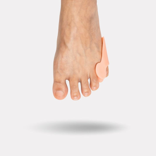 Soft silicone sleeve slipped over the little toe to cushion rubbing