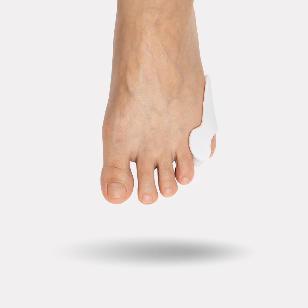 Soft silicone sleeve slipped over the little toe to cushion rubbing