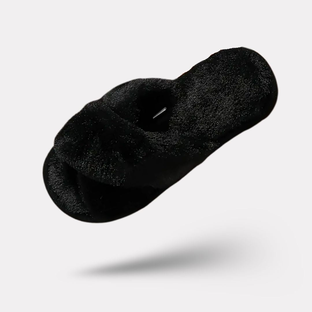 Pink fluffy slippers with a thick plush lining covering the whole foot
