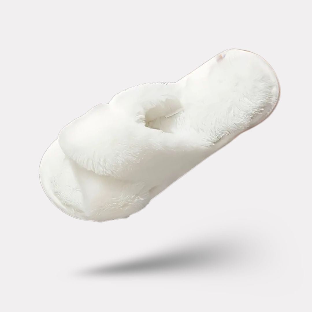 Pink fluffy slippers with a thick plush lining covering the whole foot