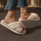 Pink fluffy slippers with a thick plush lining covering the whole foot