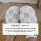 Matching pair of memory foam slippers with an open toe and a thick cushioned sole