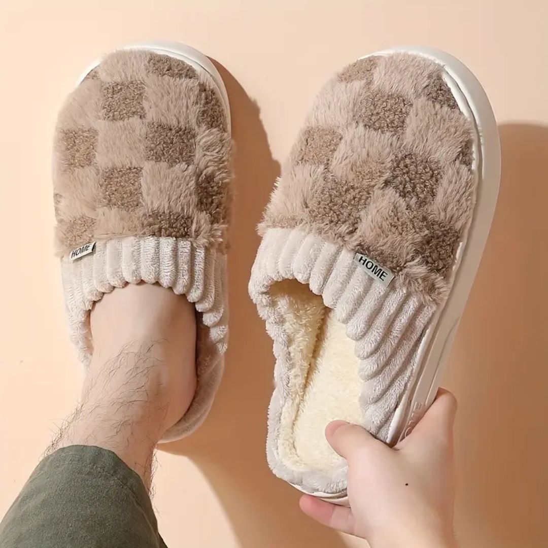 Matching pair of memory foam slippers with an open toe and a thick cushioned sole